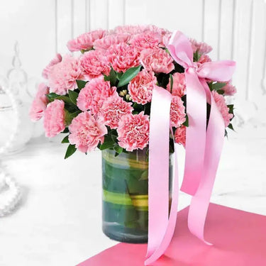 Pink Carnation Elegance, Graceful Arrangement, 40 Pink Carnations, Green Leaves, Glass Vase, Ribbon Bow